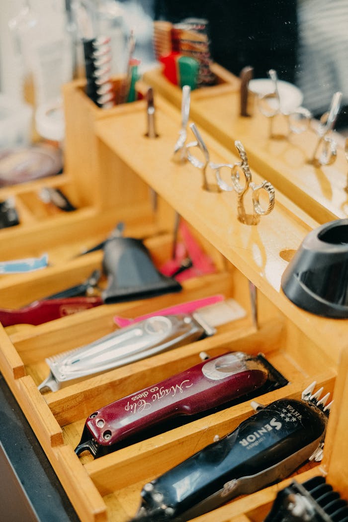 Mastering the First Impression: Your intriguing post title goes here A neatly organized barbershop tray showcasing scissors, combs, and hair trimmers.